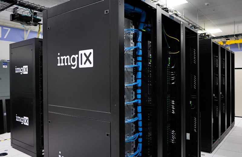 Server racks lit in blue inside a data center